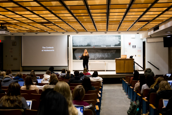 professor teaching in the front of a class